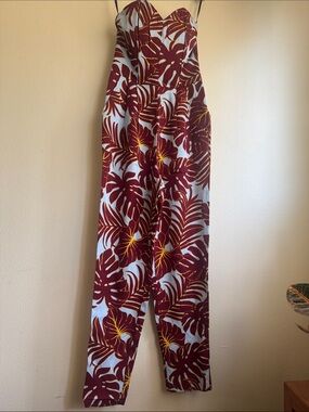 Floral Strapless Jumpsuit in Burgundy tropicals on baby blue back ground